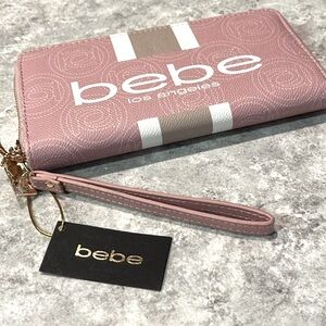 Bebe beautiful pink wristlet. Perfect for spring. Brand new. Never used. Roomy!